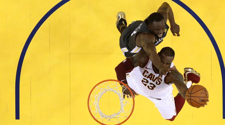 OAKLAND, CA - JUNE 03: LeBron James #23 of the Cleveland Cavaliers attempts a layup against Draymond Green #23 of the Golden State Warriors in Game 2 of the 2018 NBA Finals at ORACLE Arena on June 3, 2018 in Oakland, California. NOTE TO USER: User expressly acknowledges and agrees that, by downloading and or using this photograph, User is consenting to the terms and conditions of the Getty Images License Agreement. (Photo by Ezra Shaw/Getty Images)