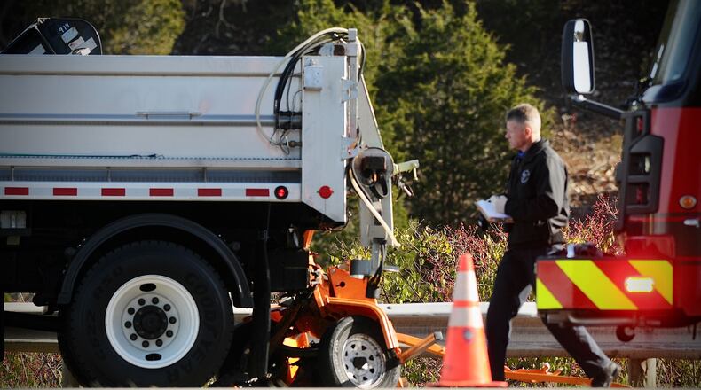 The Montgomery County Coroner's Office responded to a crash involving a pickup truck and Ohio Department of Transportation truck on I-75 north near state Route 725 in Miami Twp. on Tuesday, Nov. 23, 2021. MARSHALL GORBY / STAFF