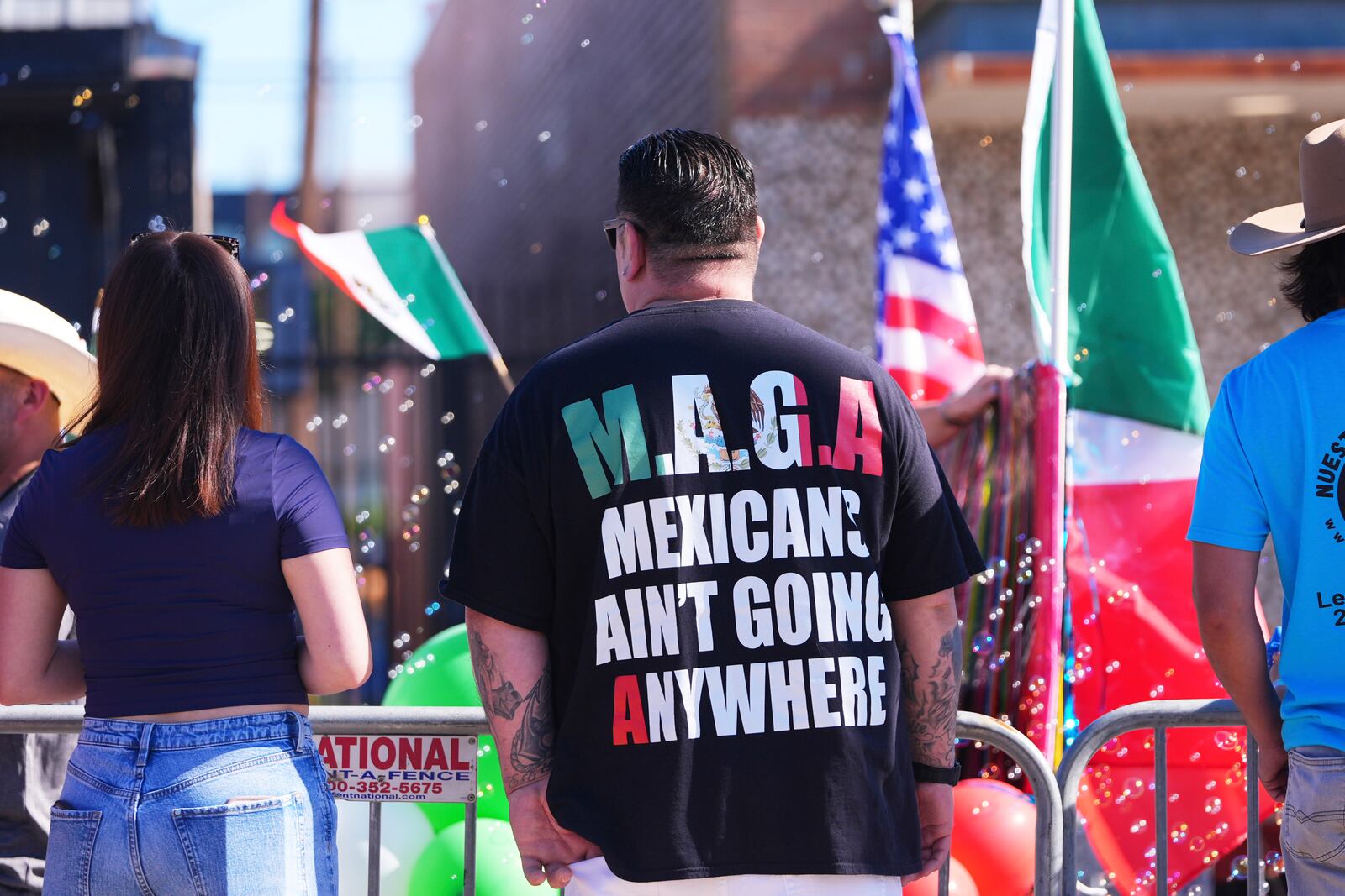 Vincent Ramirez's shirt expresses his thoughts as he watches a Cinco de Mayo parade in the Oak Cliff section of Dallas, Saturday, May 3, 2025. (AP Photo/LM Otero)