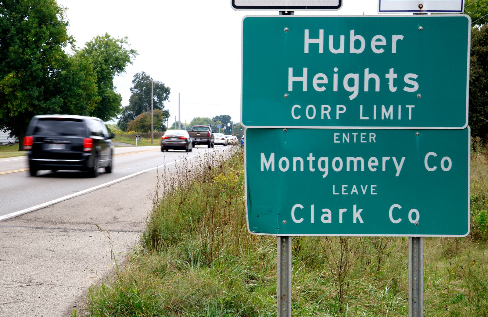 Cars pass a sign marking the Huber Heights corporation limit along Ohio 235 north of Interstate 70 near where the future Buc-ee's will be located. BILL LACKEY/STAFF