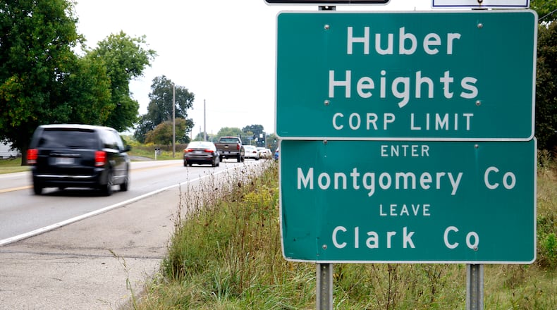 Cars past a sign marking the Huber Heights Corp. Limit along Ohio Route 235 north of Interstate 70 near where the future Buc-ee's will be located. BILL LACKEY/STAFF