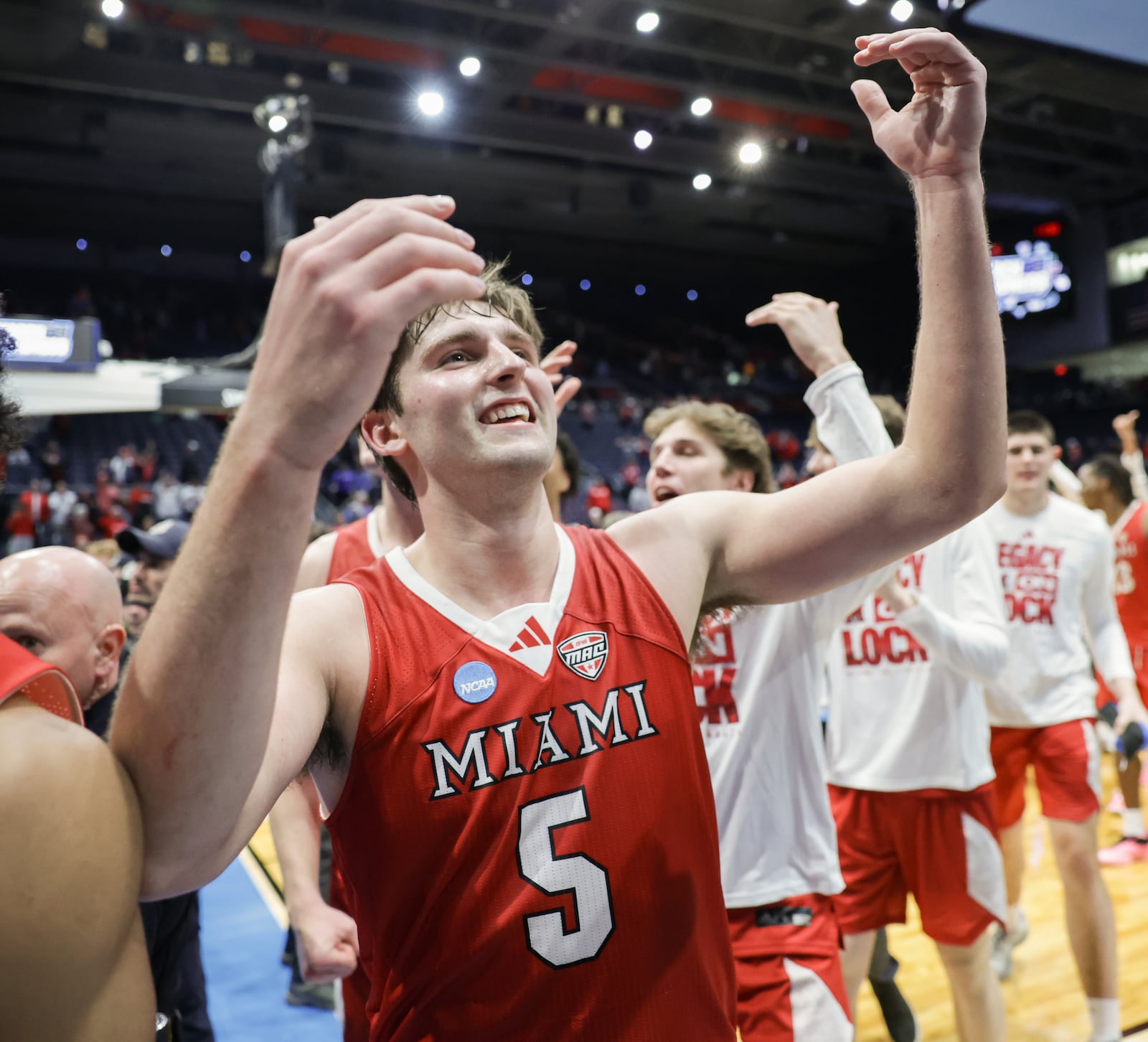 Miami University senior guard Peter Suder celebrates as he walks off the court following an 89-79 win over Southern Methodist in an NCAA First Four game on Wednesday, March 18 at University of Dayton Arena. BRYANT BILLING / STAFF
