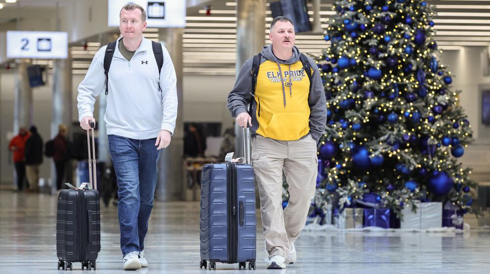 Passengers walk through the terminal at James M. Cox Dayton International Airport on Thursday, Dec. 11. AAA projects 122.4 million Americans will travel at least 50 miles from home over the 13-day year-end holiday period beginning Dec. 20 and ending Jan. 1. This will be the first time on record that the number of domestic air travelers over the year-end holiday period exceeds eight million. BRYANT BILLING/STAFF
