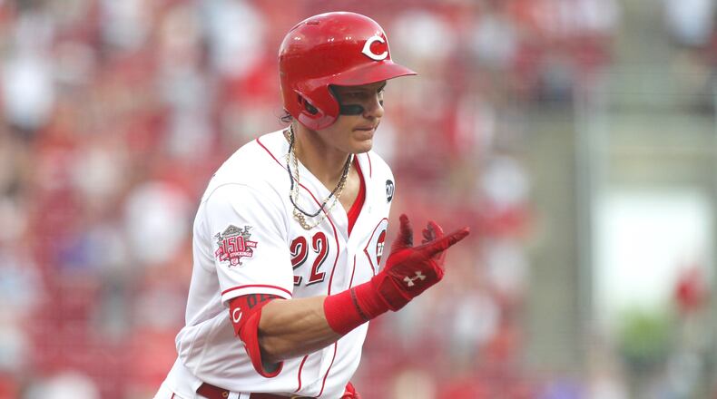 The Reds' Derek Dietrich rounds the bases after a home run in the fourth inning against the Pirates on Tuesday, May 28, 2019, at Great American Ball Park in Cincinnati.