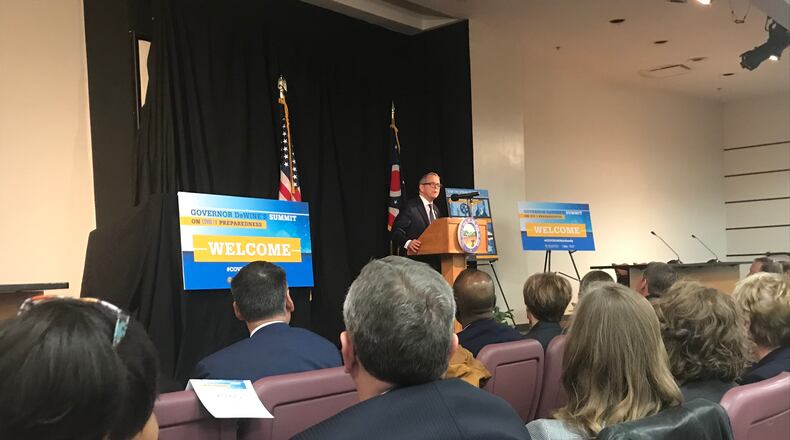 Gov. Mike DeWine addresses a crowded room gathered in Columbus of public health officials and other leaders working to remain repared in the wake of the coronavirus outbreak in other parts of the world. KAITLIN SCHROEDER