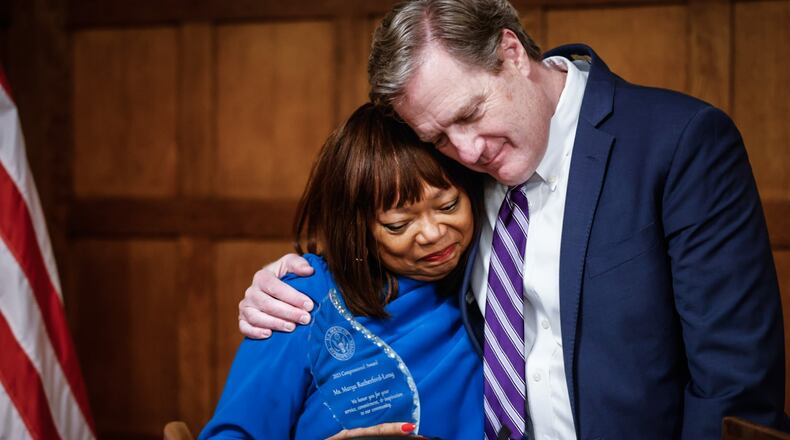 President Community and Economic Development Manager for the Dayton Region at Fifth Third Bank Marya Rutherford-Long received the annual Congressional Community Service Award from Ohio Congressman Mike Turner at the Engineers Club on Monument Street in Dayton Friday Nov. 17, 2023. JIM NOELKER / STAFF