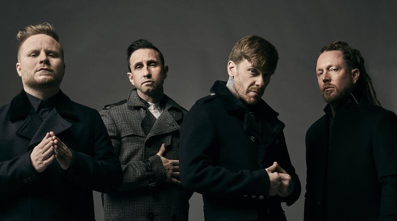 Shinedown, (left to right) Zach Myers, Eric Bass, Brent Smith and Barry Kerch, performs at the Nutter Center in Fairborn on Tuesday, Feb. 26. CONTRIBUTED/JIMMY FONTAINE