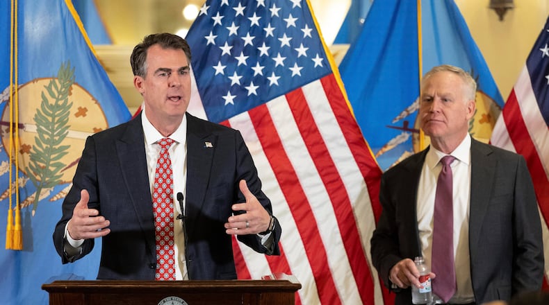 Oklahoma Governor Kevin Stitt and his appointee to the U.S. Senate, Alan Armstrong speaks to state leaders, reporters, and friends after he was announced by Oklahoma Governor Kevin Stitt's as his choice to temporarily fill Senator Markwayne Mullin's seat during a press conference at the Oklahoma State Capitol in Oklahoma City, Tuesday, March 24, 2026, Oklahoma City. (AP Photo/Alonzo Adams)