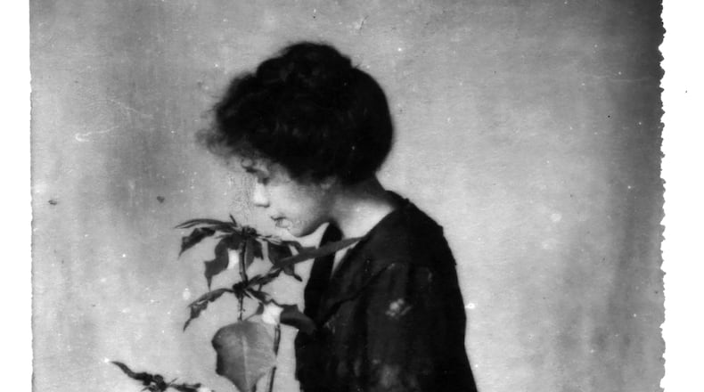 "The Poinsettia Girl," is Reece's self-portrait taken in 1907. PHOTO COURTESY OF THE DAYTON ART INSTITUTE