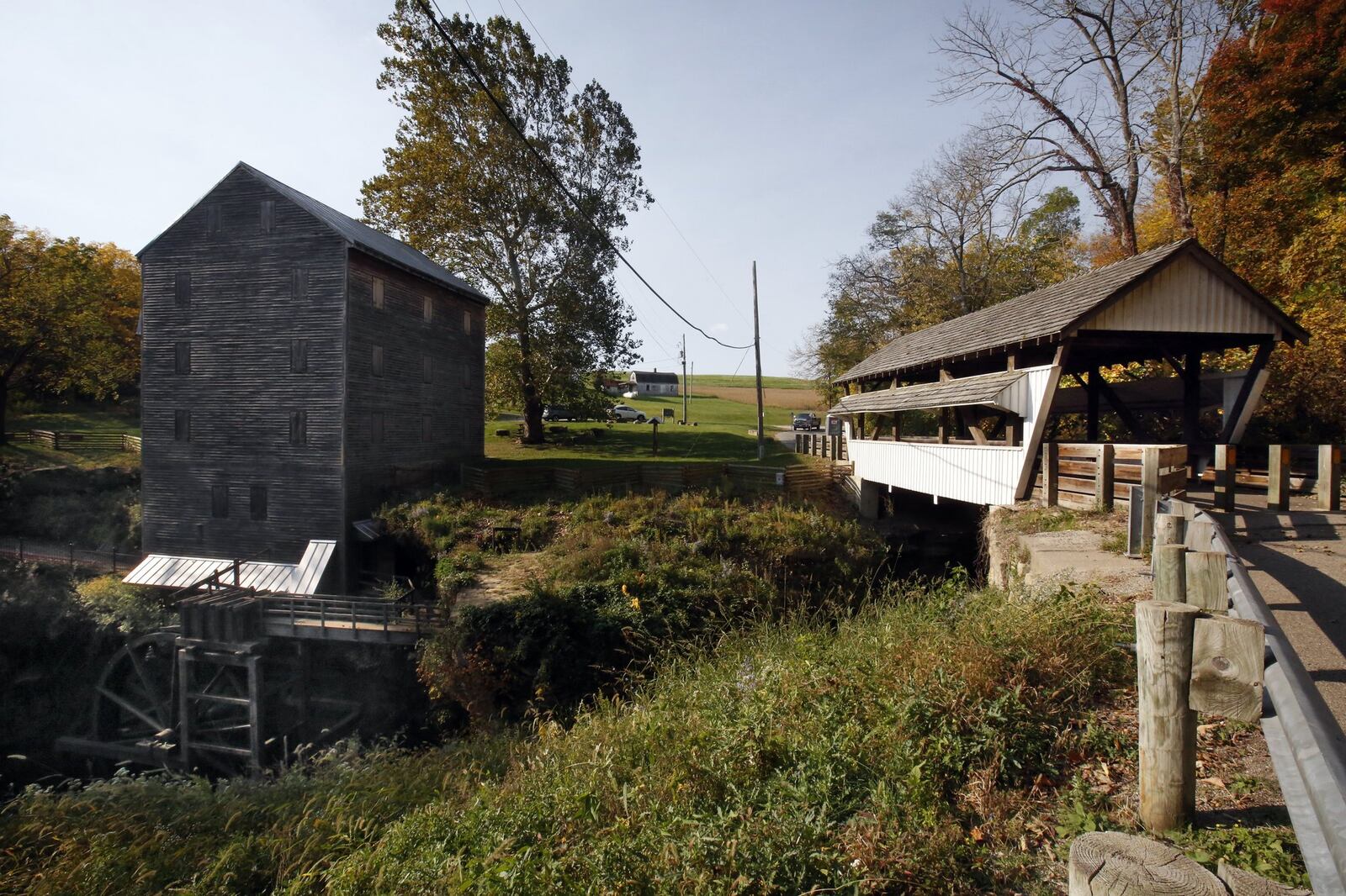 A child peeks out of the top floor window of the Rock Mill into the gorge below. Built in 1824 the Rock Mill stands six floors high above the mouth of the gorge and was according to local lore was supposed to be both a grist and woolen mill. EAMON QUEENEY/THE COLUMBUS DISPATCH