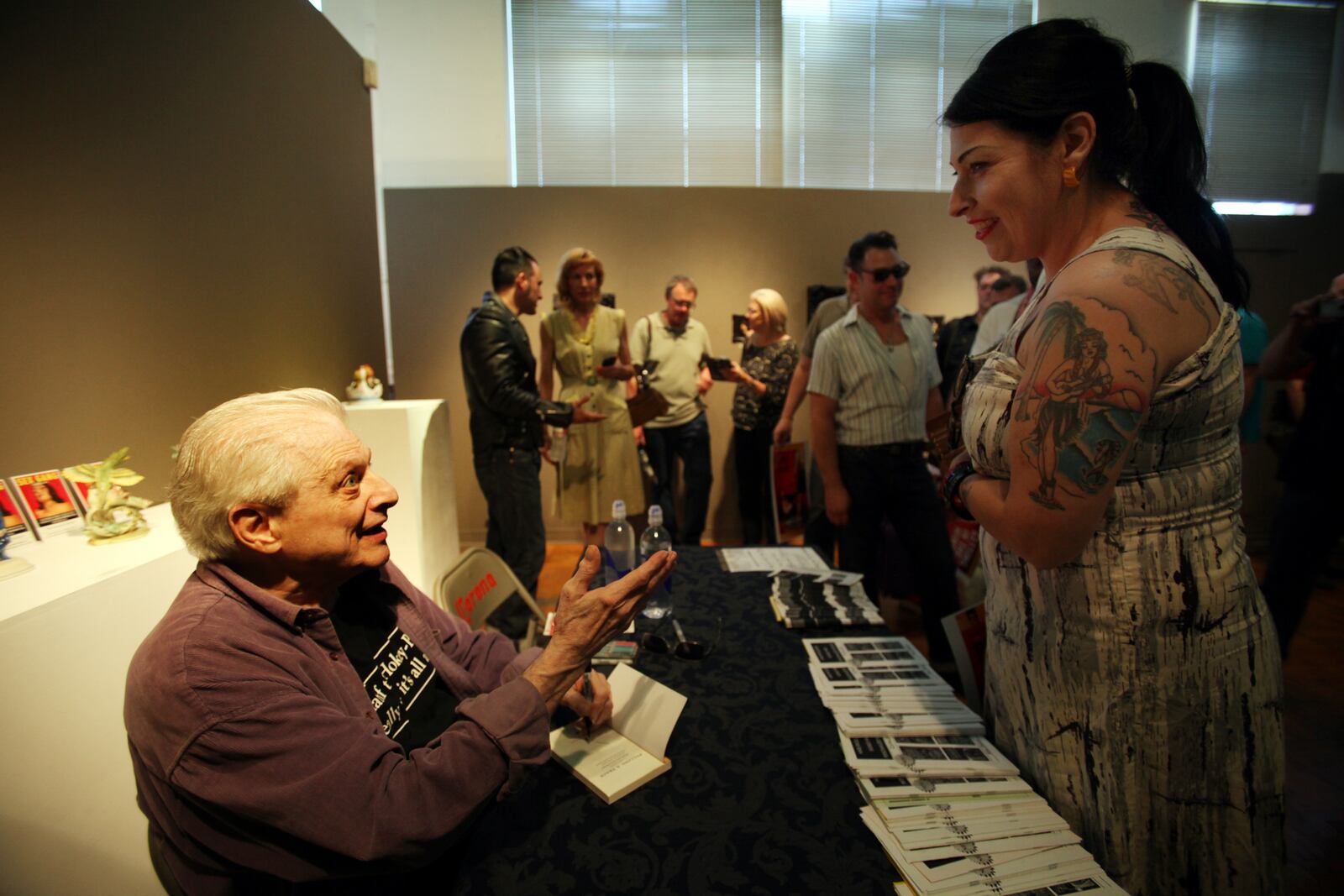 In a 2013 file image, writer Harlan Ellison speaks with his fans at La Luz de Jesus Gallery in Los Angeles during a book signing. (Francine Orr/Los Angeles Times/TNS)
