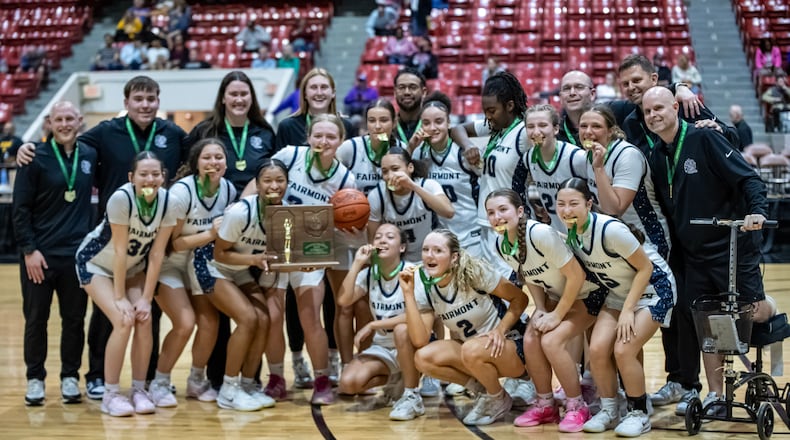 The Fairmont High School girls basketball poses with the trophy after beating Olentangy 66-45 to win the Division I, Region 2 championship on Friday, March 6, 2026 at the Ohio Expo Center's Taft Coliseum. MICHAEL COOPER / STAFF