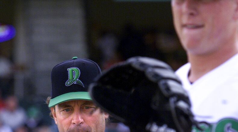 Ted Power, the Reds pitching coach, watches Chris Gruler warm up prior to a game. Gruler was the number one draft pick in this years draft of the Cincinnati Reds.