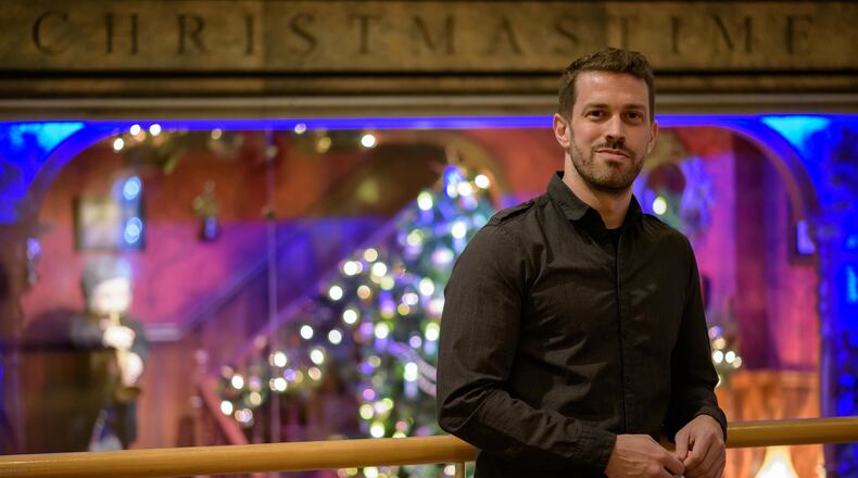 Dayton native Adam Koch redesigned the animated Rike’s windows on display in the Schuster Center’s Wintergarden. CONTRIBUTED/TOM GILLIAM