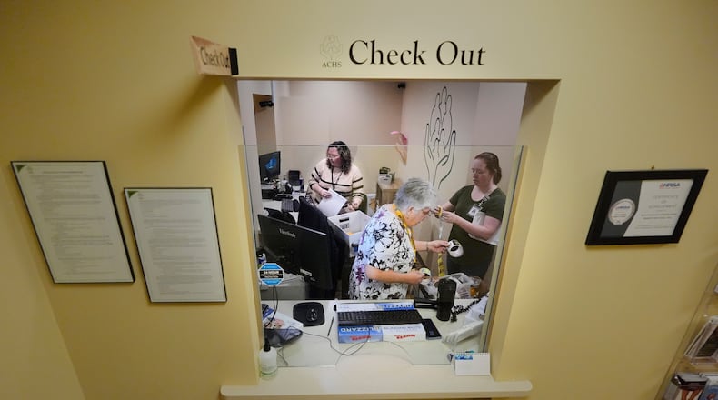 Employees at Ammonoosuc Community Health Services pack up the reception office as the clinic closes for good, Thursday, Oct. 23, 2025, in Franconia, N.H. (AP Photo/Robert F. Bukaty)