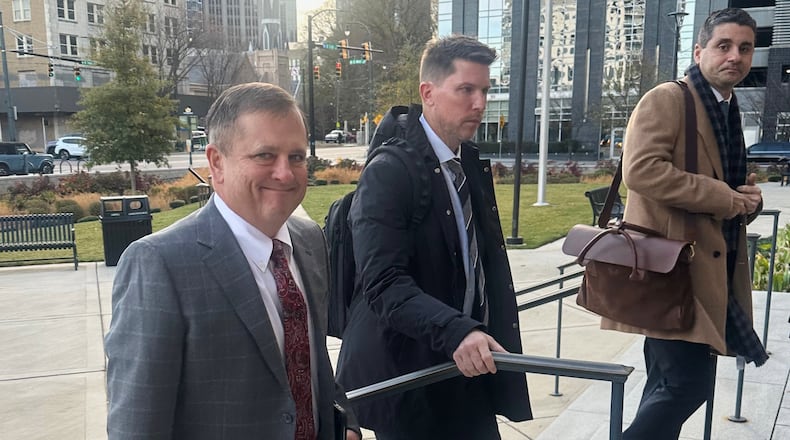 FILE - Front Row Motorsports owner Bob Jenkins, left, and 23XI co-owner Denny Hamlin arrive in the Western District of North Carolina on Monday Dec 1, 2025 in Charlotte, N.C. (AP Photo/Jenna Fryer, File)