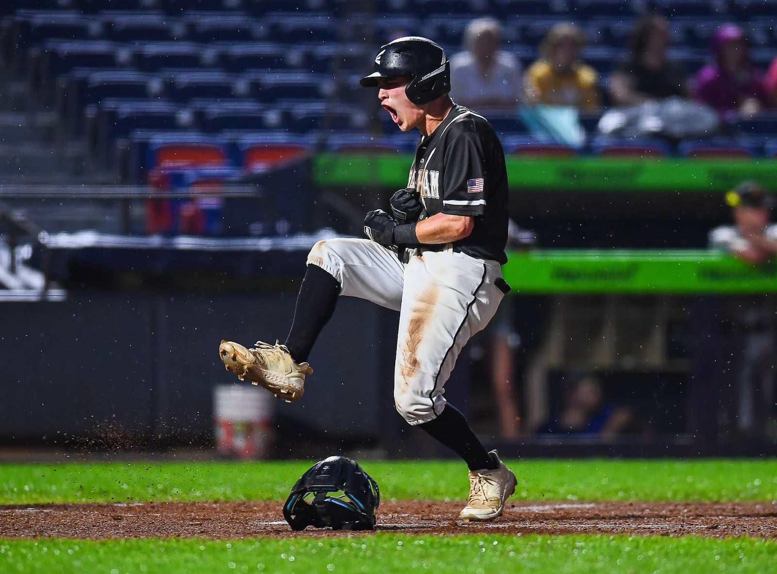 Graham's Owen Powell celebrates after scoring a run during his Division V state semifinal game against Lynchburg-Clay on Friday at Canal Park in Akron. KYLE HENDRIX / CONTRIBUTED