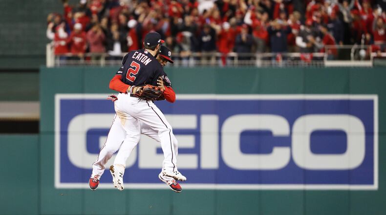 The Nationals' Juan Soto and Adam Eaton celebrate winning game four and the National League Championship Series against the St. Louis Cardinals at Nationals Park on October 15, 2019 in Washington, DC. (Photo by Patrick Smith/Getty Images)