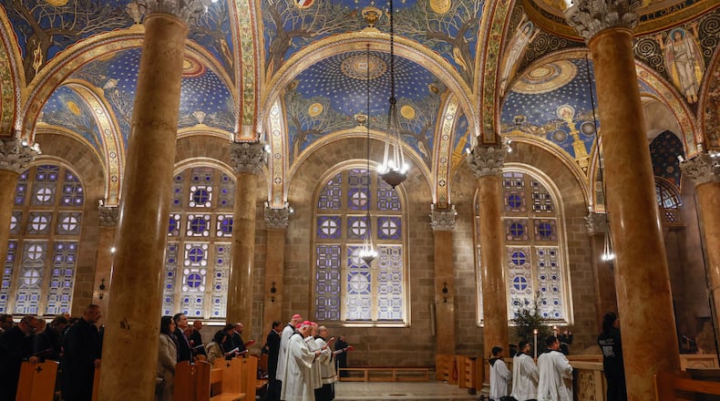 Faithful attend a prayer service in the Church of All Nations, held by Cardinal Pierbattista Pizzaballa, the Latin Patriarch of Jerusalem, to mark Palm Sunday in Jerusalem, Sunday, March 29, 2026. (Ammar Awad/Pool Photo via AP)