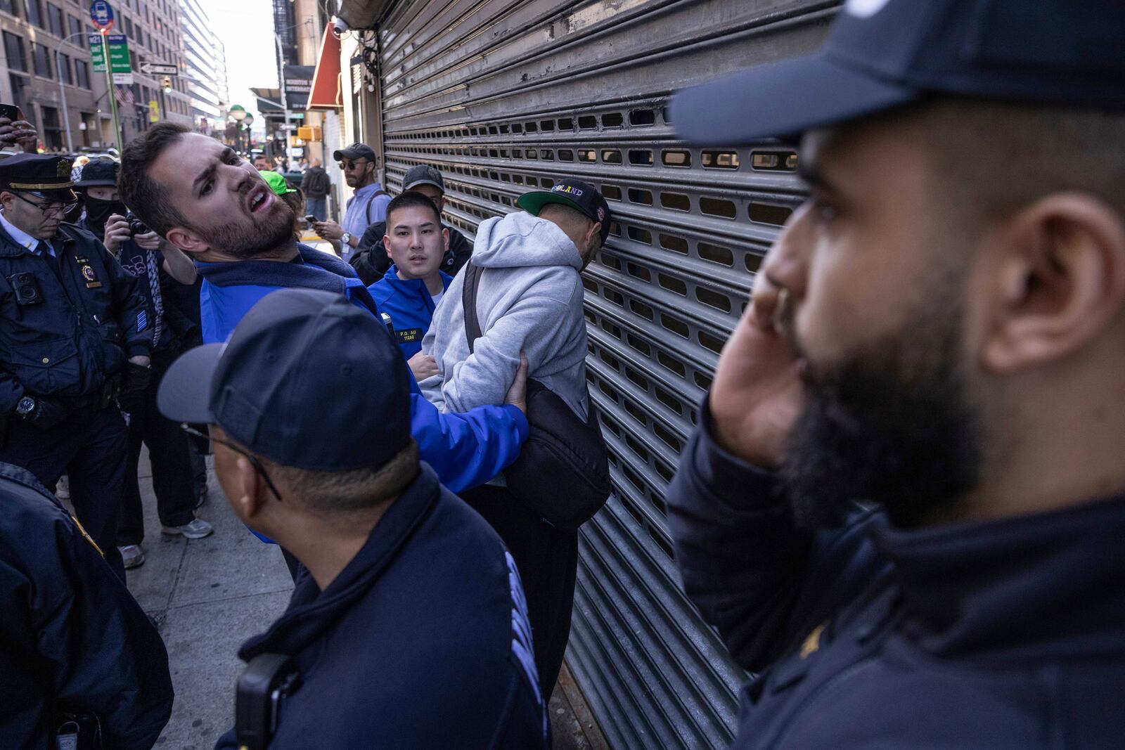 NYPD officers arrest a person during a demonstration in support of Palestinian activist Mahmoud Khalil, Tuesday, March 11, 2025, in New York. (AP Photo/Yuki Iwamura)