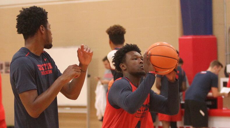 Dayton’s Jordan Davis warms up for a practice at the Cronin Center in Dayton. David Jablonski/Staff