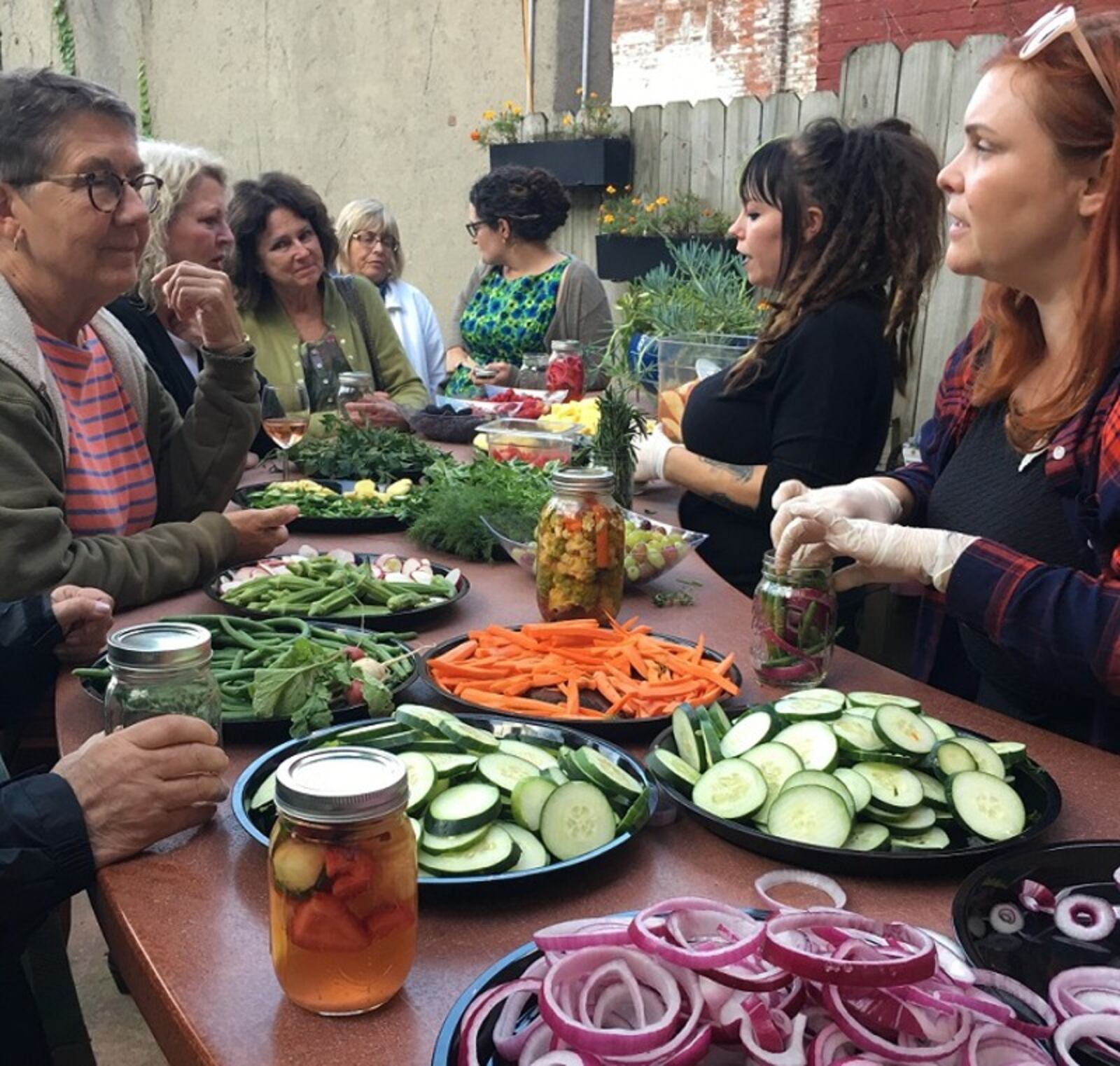 Lily s Bistro owner Emily Mendenhall (far right) and bar manager Amber Brady at Lily s Bistro s Garden Party in September. ALEXIS LARSEN/CONTRIBUTED
