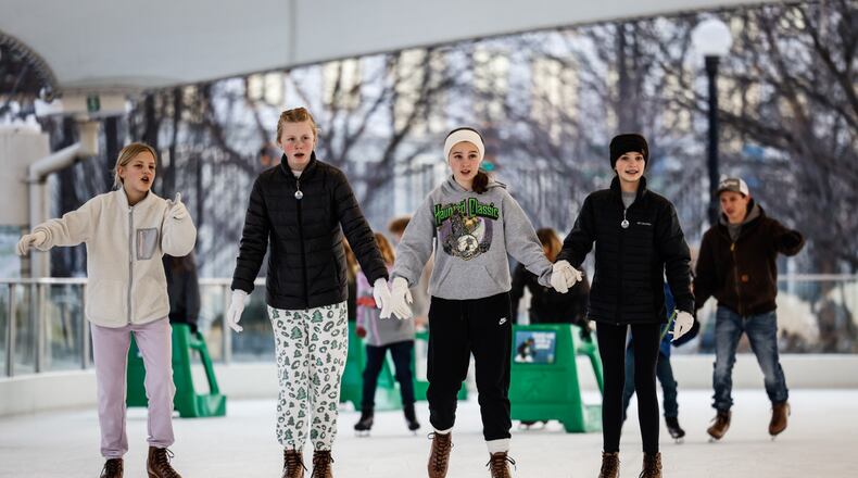 Lots of people enjoyed the warm weather on the first day of winter, 2021, at RiverScape in Dayton. Jim Noelker/Staff