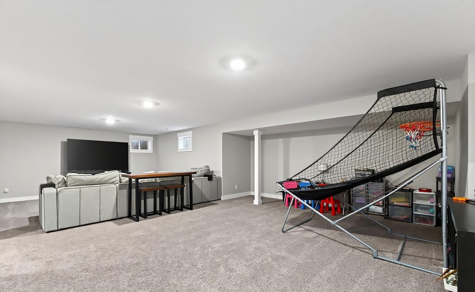 The finished basement has a recreation room, two bedrooms and a bathroom. The recreation room has neutral carpeting and recessed lighting. CONTRIBUTED