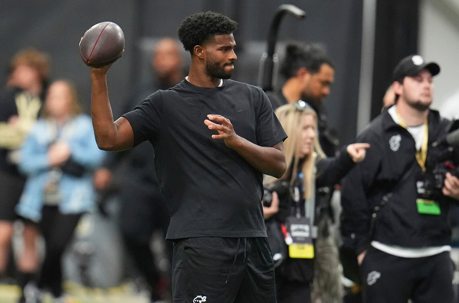 Colorado quarterback Shedeur Sanders takes part in passing drills during Colorado's NFL football pro day Friday, April 4, 2025, in Boulder, Colo. (AP Photo/David Zalubowski)