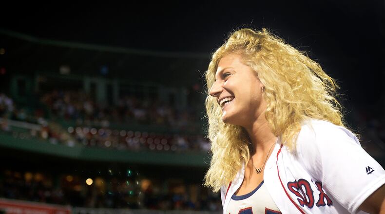 BOSTON, MA - AUGUST 28: Olympic gold medal Judoka Kayla Harrison is introduced before throwing out a ceremonial first pitch before a game between the Boston Red Sox and the Kansas City Royals on August 28, 2016 at Fenway Park in Boston, Massachusetts. (Photo by Adam Glanzman/Getty Images)