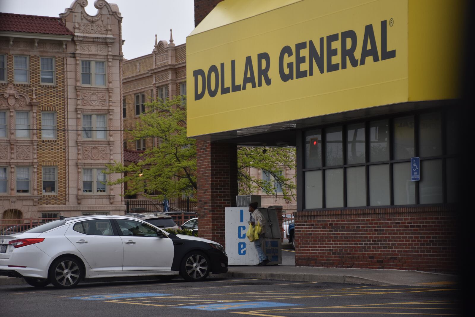 A customer walks out of the Dollar General store at 445 Salem Ave. in northwest Dayton. CORNELIUS FROLIK / STAFF