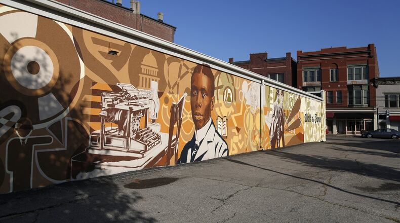 In Dayton’s Wright-Dunbar neighborhood the Dayton Region’s Walk of Fame mural, in the 1100 block of W. Third Street, commemorates poet Paul Laurence Dunbar and aviation pioneers Orville and Wilbur Wright. LISA POWELL / STAFF