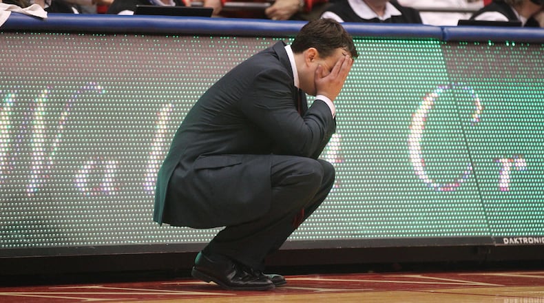 Archie Miller covers his eyes during a game against Virginia Commonwealth on March 1, 2017. David Jablonski/Staff