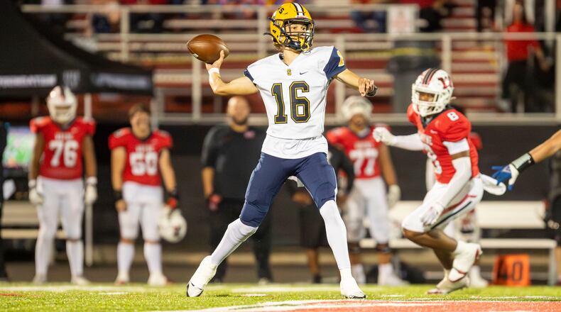 Springfield High School quarterback Brent Upshaw throws the ball during their game against Wayne on Friday night in Huber Heights. The Wildcats won 38-14. Michael Cooper/CONTRIBUTED