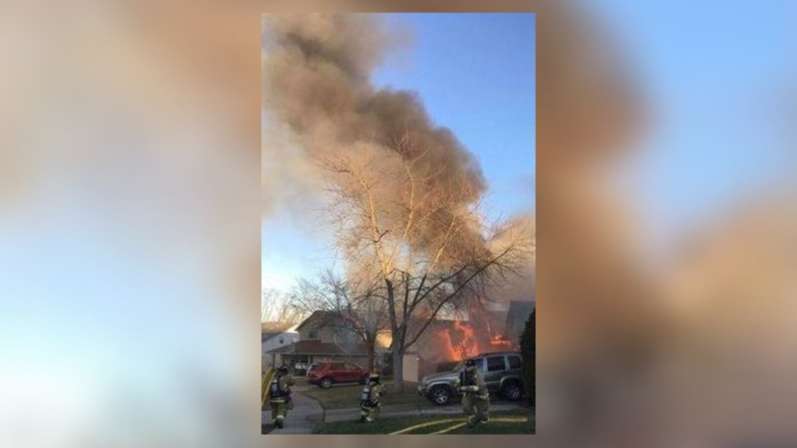 Heavy flames were showing from a house in Huber Heights when firefighters arrived.  (Andrew Shelton / Facebook)