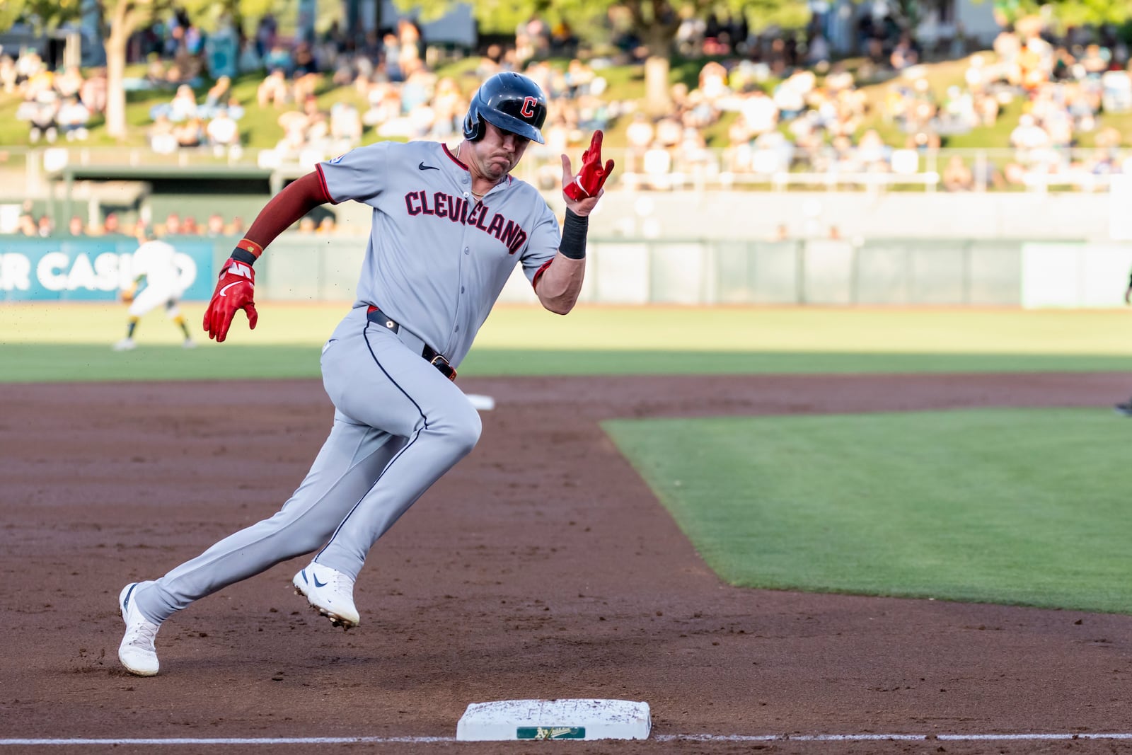 Cleveland Guardians' Nolan Jones rounds third base to score during the second inning of a baseball game against the Athletics Saturday, June 21, 2025, in West Sacramento, Calif. (AP Photo/Sara Nevis)