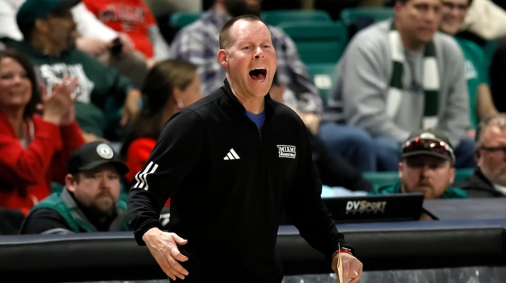Miami (Ohio) head coach Travis Steele shouts to his team during the second half of an NCAA college basketball game against the Eastern Michigan Tuesday, Feb. 24, 2026, in Ypsilanti, Mich. (AP Photo/Duane Burleson)