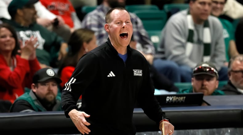 Miami (Ohio) head coach Travis Steele shouts to his team during the second half of an NCAA college basketball game against the Eastern Michigan Tuesday, Feb. 24, 2026, in Ypsilanti, Mich. (AP Photo/Duane Burleson)