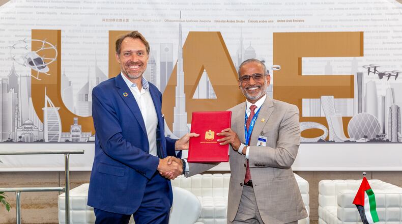 joeBen Bevirt, founder and chief executive of Joby, presents the company’s letter of intent to initiate Joby’s air operator certificate application to Saif Mohammed Al Suwaidi, director General of the UAE General Civil Aviation Authority. Christina Esteban Photography