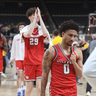 Dayton players, including Javon Bennett, center, leave the court after a loss to Virginia Commonwealth in the Atlantic 10 Conference championship game on Sunday, March 15, 2026, at PPG Paints Arena in Pittsburgh. David Jablonski/Staff