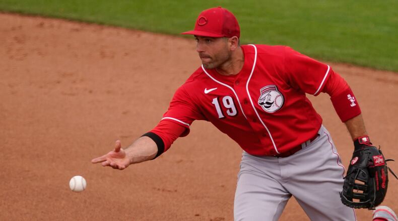 Cincinnati Reds’ Joey Votto throws out San Francisco Giants’ Patrick Bailey during the third inning of a spring training baseball game, Saturday, March 26, 2022, in Scottsdale, Ariz. (AP Photo/Matt York)