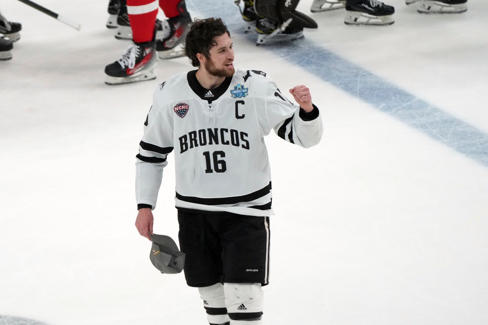 Western Michigan's Tim Washe celebrates after defeating Boston University in the championship game of the NCAA Frozen Four men's college hockey tournament, Saturday, April 12, 2025, in St. Louis (AP Photo/Jeff Roberson)