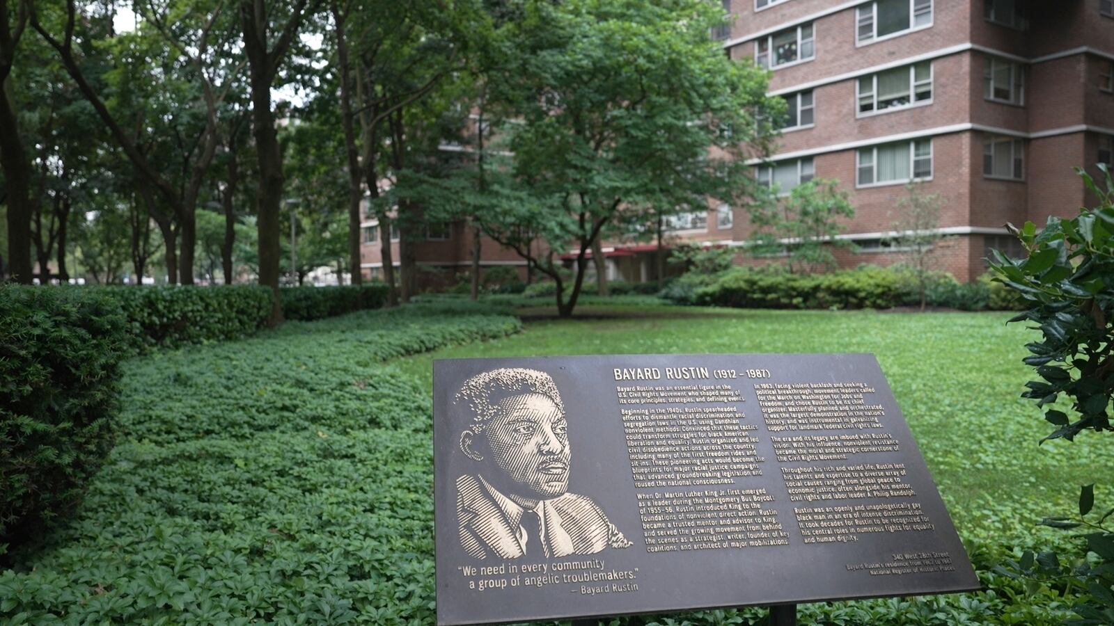 In this still image taken from video, a plaque honoring Bayard Rustin is pictured outside of partner Walter Naegle's home on Saturday, June 28, 2025, in New York. (AP Photo/Mary Conlon)