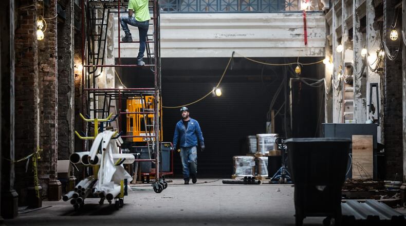 Work continues at the Arcade on the Third Street side of building Wednesday September 27, 2023. The Dayton region sees another month of sturdy employment gains. JIM NOELKER/STAFF