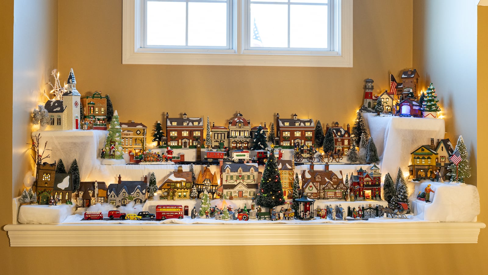 Above the front door of the home of Doug and Anita Wales in Miami Twp. sits a Dickens village. "I have to use a 10-foot ladder to put it up," said Anita Wales. BRYANT BILLING/STAFF