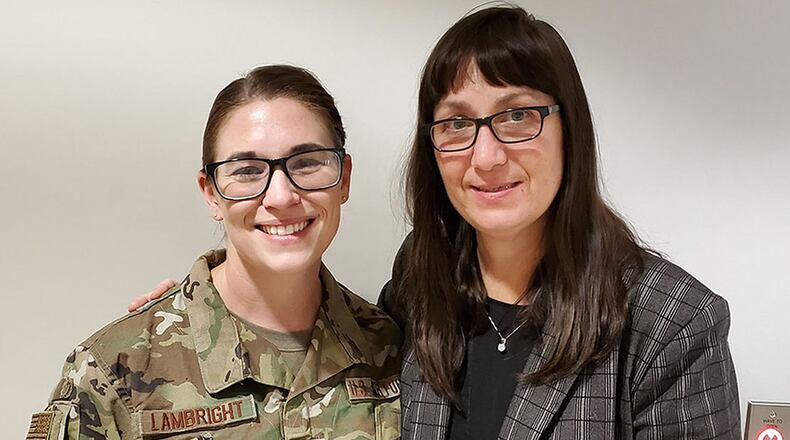 Staff Sgt. Chaya Lambright (left), a medical laboratory technician with the 711 Human Performance Wing, was recently recognized for assisting Bridget Kleismit (right) during a medical emergency at the Wright Field Fitness Center on Wright-Patterson Air Force Base. (U.S. Air Force photo)