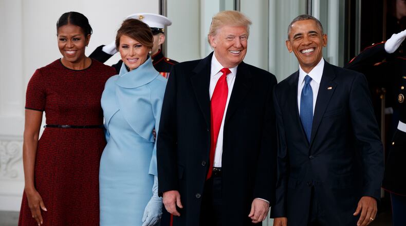 President Barack Obama, first lady Michelle Obama, President-elect Donald Trump and Melania Trump stand at the White House in Washington, Friday, Jan. 20, 2017. (AP Photo/Evan Vucci)