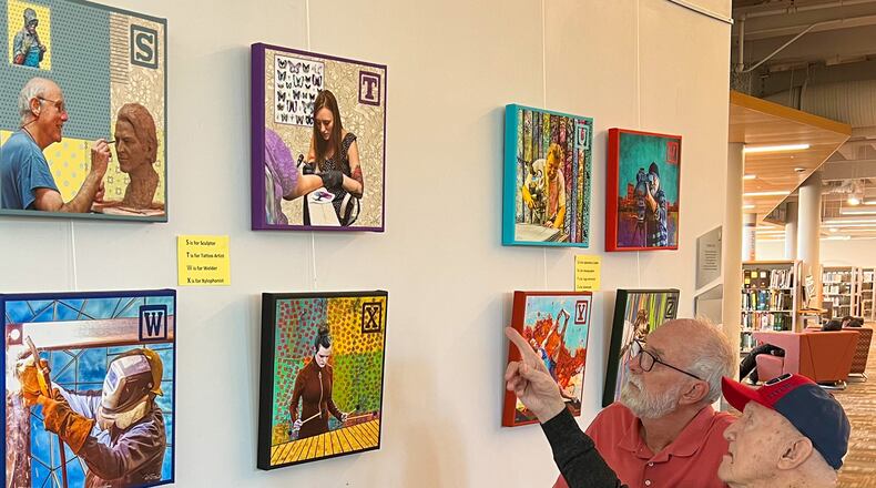 Bill Franz and father-in-law Wally Willaman discuss their A-to-Z project at Dayton’s Metro Library. CONTRIBUTED PHOTOS