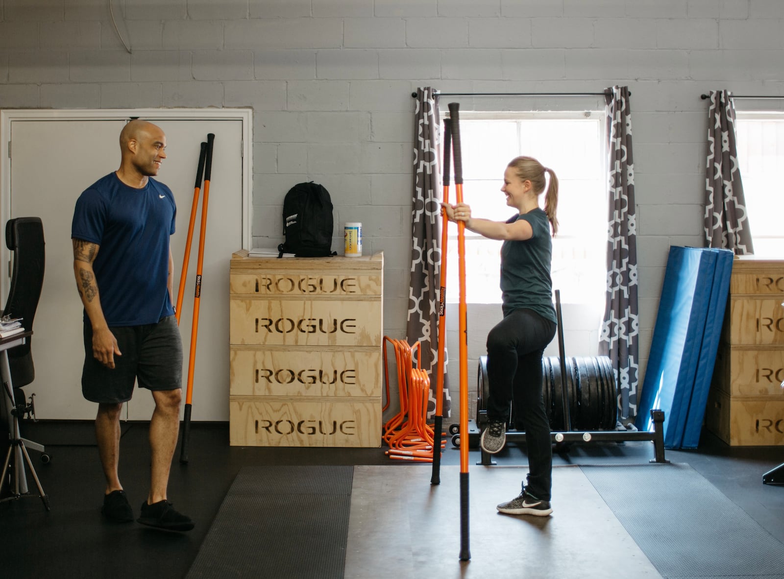 Present Tense Fitness co-owner Jason Harrison works with Dayton Ballet dancer Katy Gilliam. CONTRIBUTED