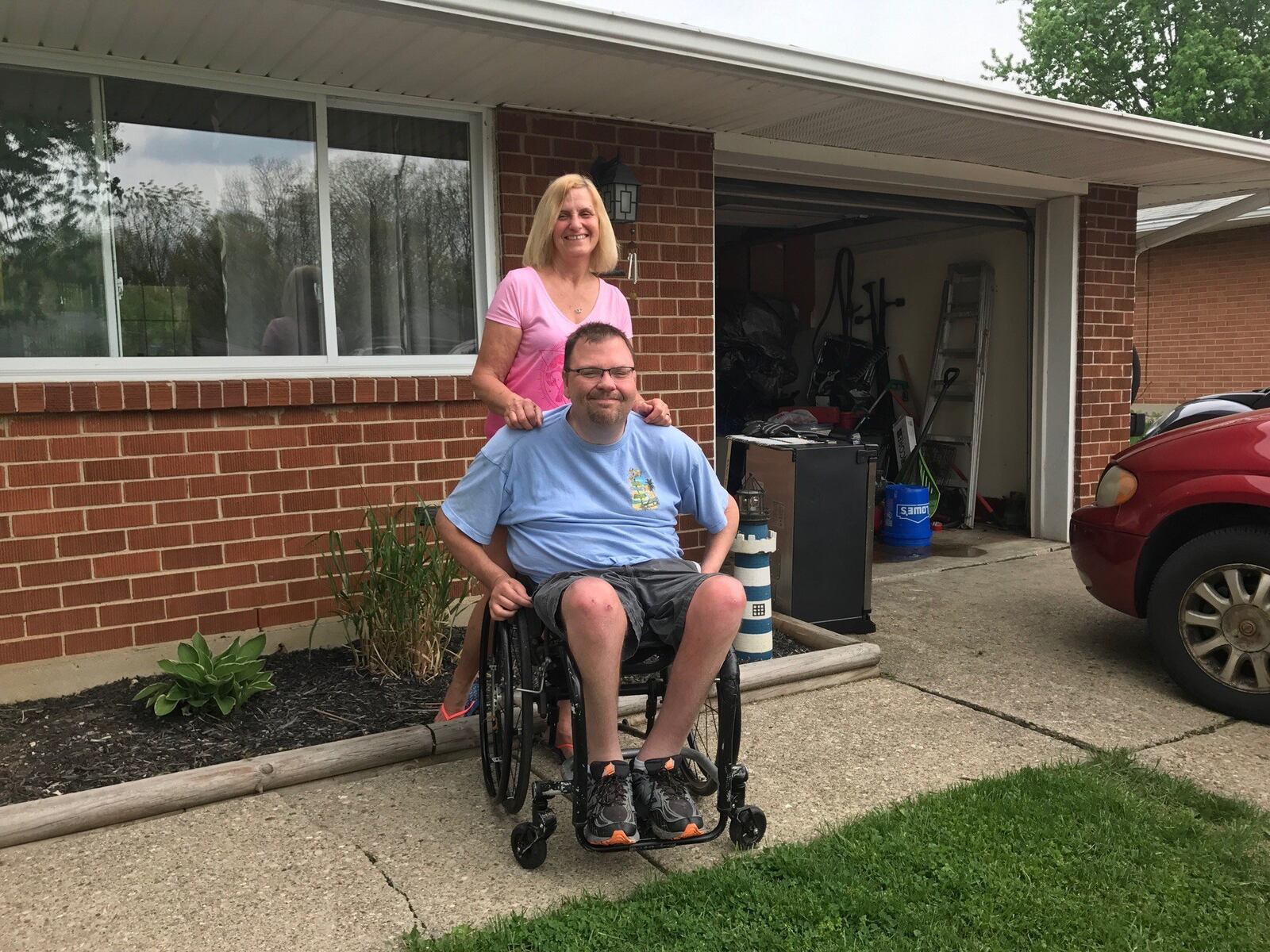 Damien Paul and his mom Gina Thomas at their Huber Heights home Friday. Tom Archdeacon/STAFF